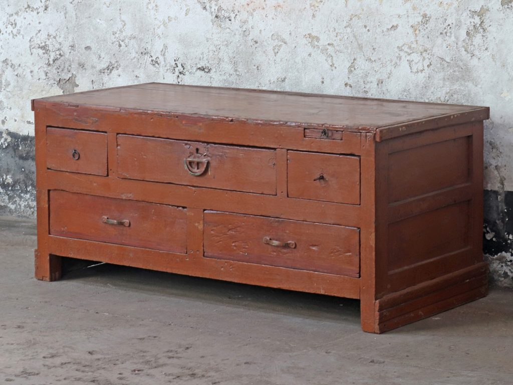 vintage chest of drawers used as a TV stand